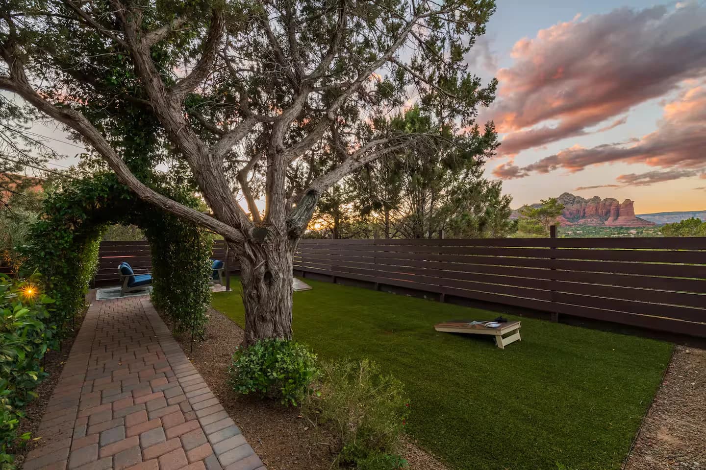 Backyard with a sweeping red rock panorama at sunset